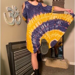 Tie-dye long flowy dress with embroidery around chest area. One size fits most!